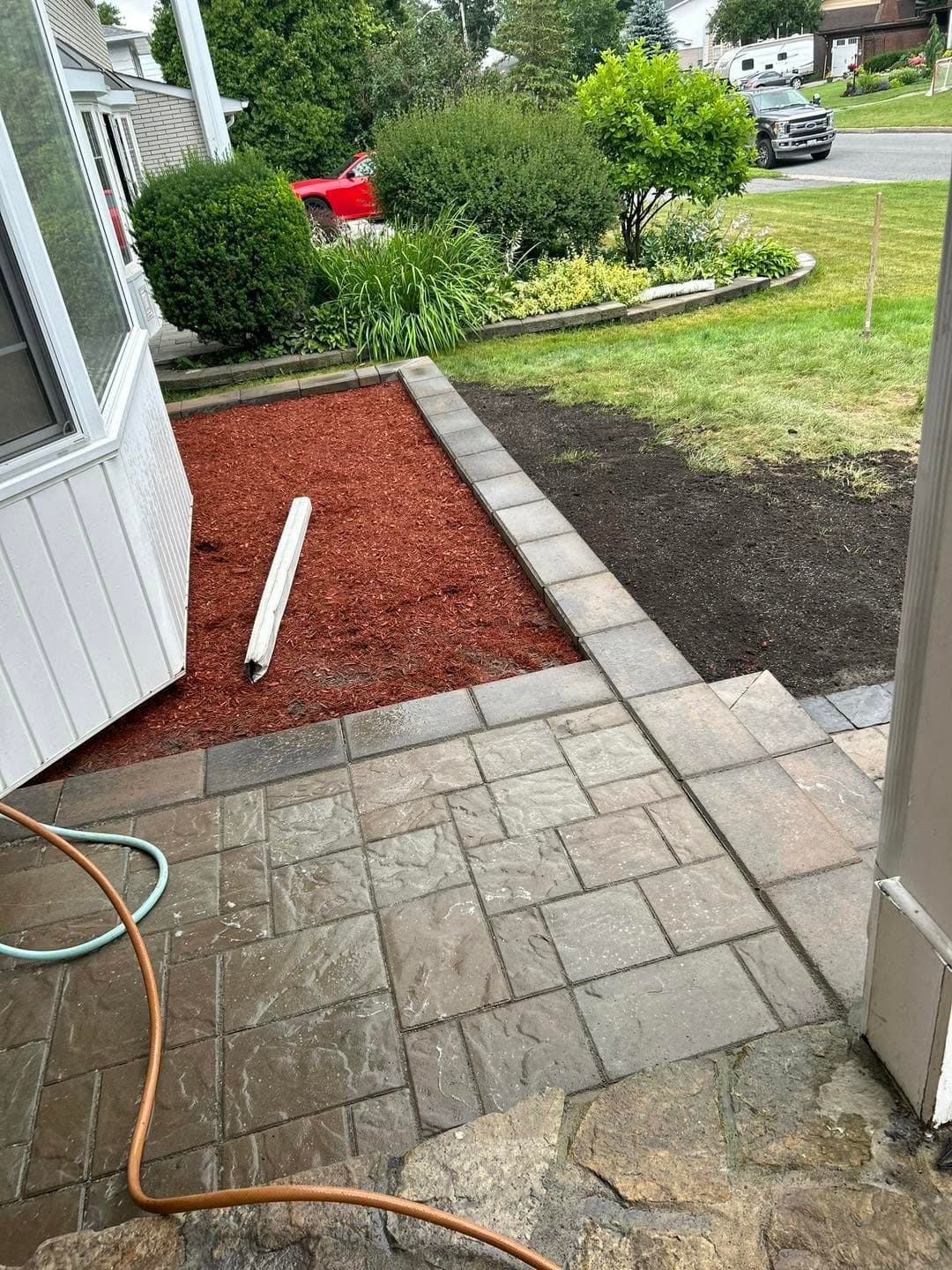 Flagstone steps beside a fresh mulch garden bed